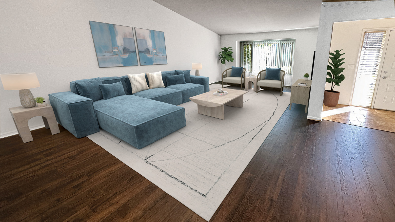 A living room with a blue couch and a white rug.
